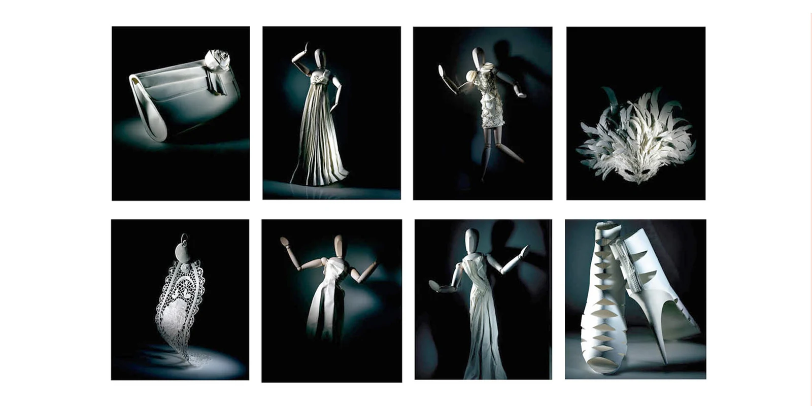 White paper fashion figures photographed on black